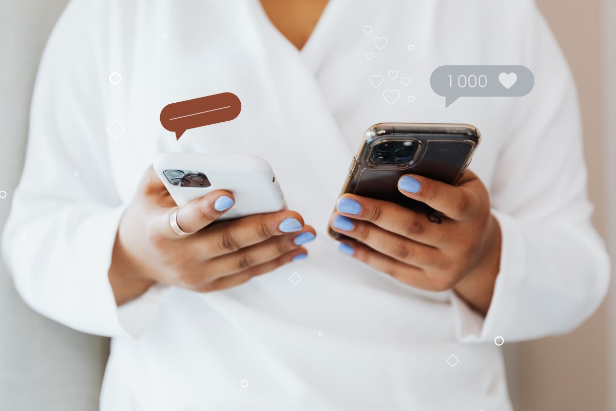 woman holding two smartphones, with social media reaction speech balloons above